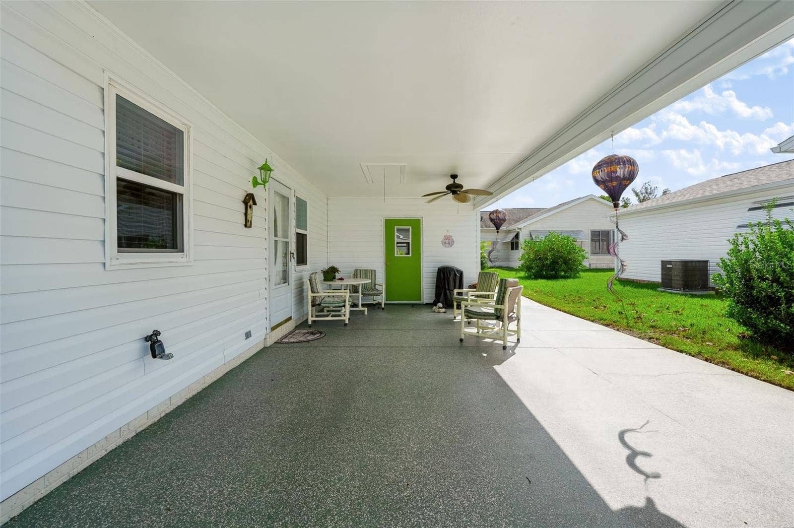 1220 MARIA COURT, Lady Lake, FL 32159 Covered parking and patio
