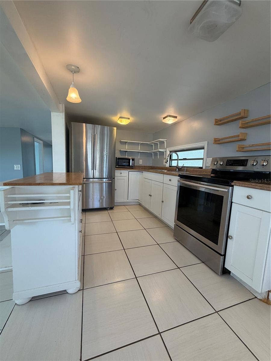4120 BUENA VISTA LANE, Holiday, FL 34691 Kitchen with ceramic tile.