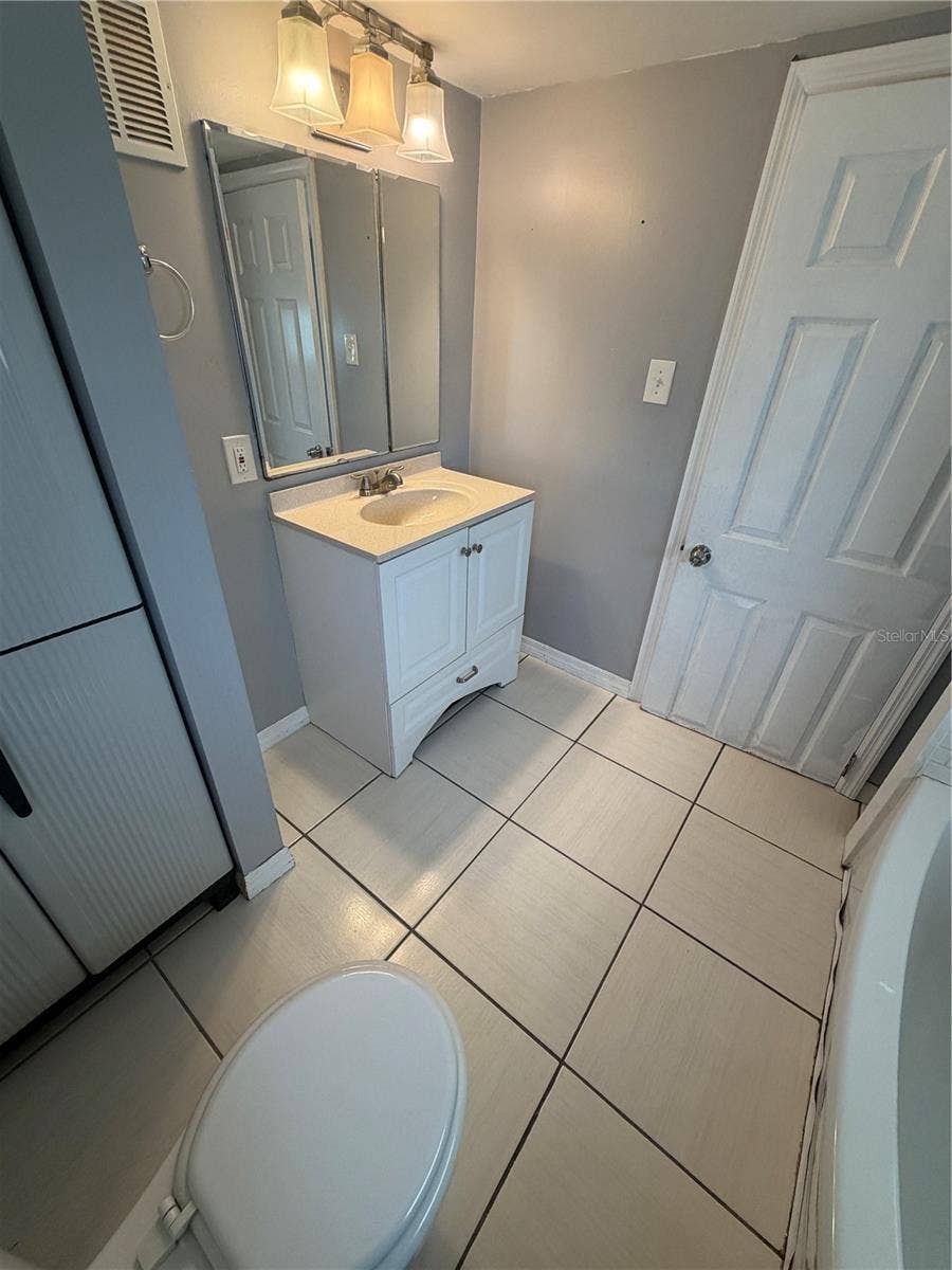 4120 BUENA VISTA LANE, Holiday, FL 34691 Bathroom with sink, tub/shower combo and toilet.
