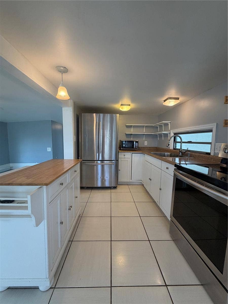 4120 BUENA VISTA LANE, Holiday, FL 34691 Kitchen with stainless appliances.