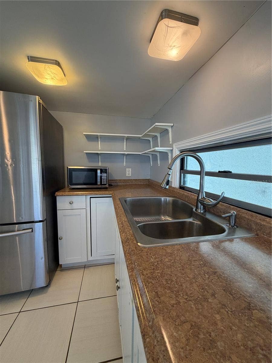 4120 BUENA VISTA LANE, Holiday, FL 34691 Kitchen with update lighting.