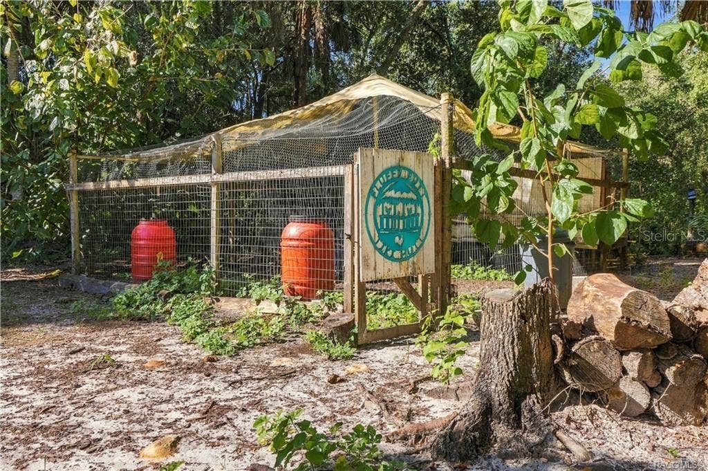 7528 N CHABAUD TERRACE, Crystal River, FL 34428 A LITTLE COUNTRY CHARM! This fenced outdoor enclosure offers a dedicated space surrounded by mature trees & natural Florida greenery.
