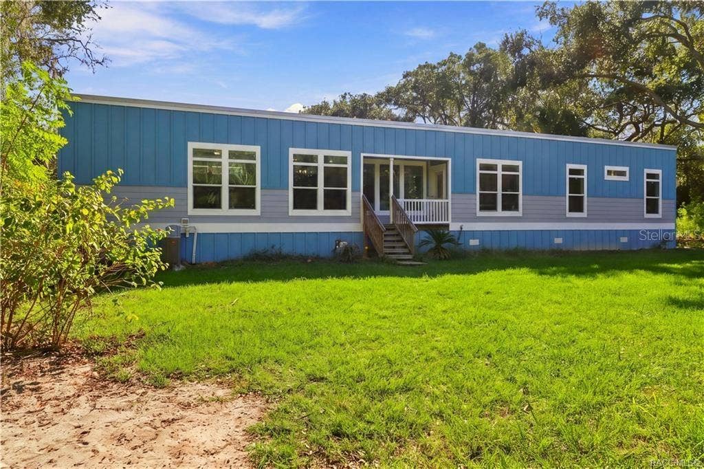 7528 N CHABAUD TERRACE, Crystal River, FL 34428 SPACE TO ENJOY THE OUTDOORS! The spacious lawn, mature shade trees & inviting covered front porch create a wonderful setting for enjoying the peaceful surroundings.