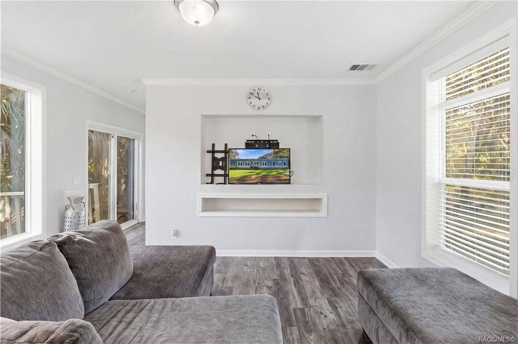 7528 N CHABAUD TERRACE, Crystal River, FL 34428 A COZY PLACE TO UNWIND! Enjoy the comfortable living area featuring large windows, neutral finishes & a recessed entertainment space.