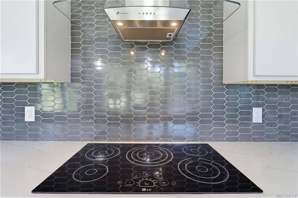 7528 N CHABAUD TERRACE, Crystal River, FL 34428 PLENTY OF ROOM TO COOK & CREATE! Enjoy extensive GRAY CABINETRY, stainless steel appliances, an LG SMART OVEN, CONVECTION MICROWAVE & spacious center island.