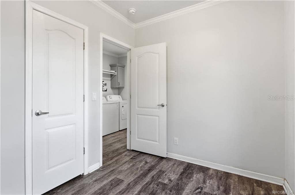 7528 N CHABAUD TERRACE, Crystal River, FL 34428 FLEXIBILITY FOR YOUR LIFESTYLE! Another view of this room highlights the attractive flooring, natural light & convenient access to the indoor laundry area.