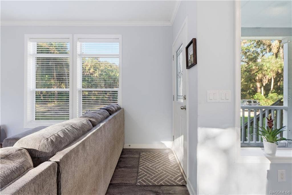 7528 N CHABAUD TERRACE, Crystal River, FL 34428 BRIGHT, CHEERFUL & INVITING! Natural light fills the entry area, complemented by LUXURY VINYL PLANK FLOORING, soft neutral colors & crisp white trim.