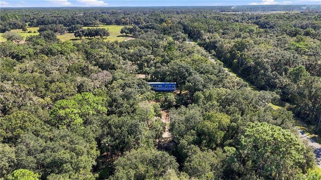 7528 N CHABAUD TERRACE, Crystal River, FL 34428 FLORIDA'S NATURAL BEAUTY! Another stunning aerial perspective showcases the surrounding tree canopy, lush vegetation & peaceful, wooded setting.