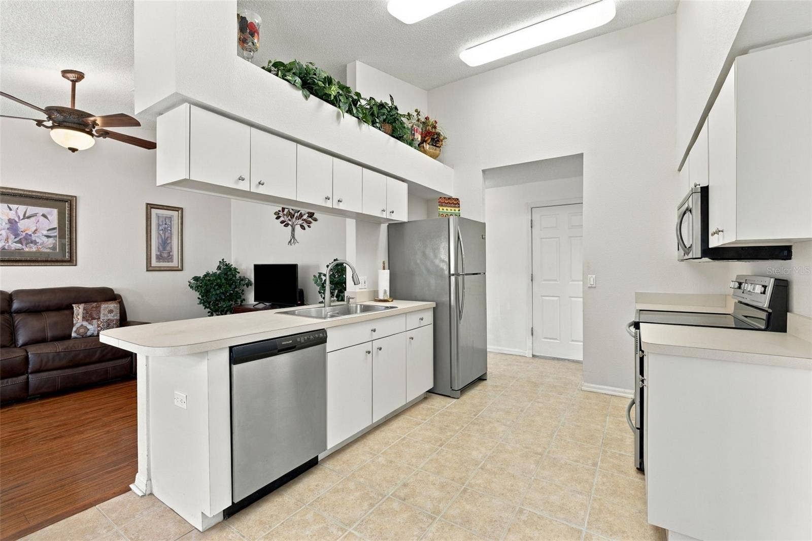 1149 WOLFORD DRIVE, New Port Richey, FL 34655 Bright kitchen adjacent to the family room.