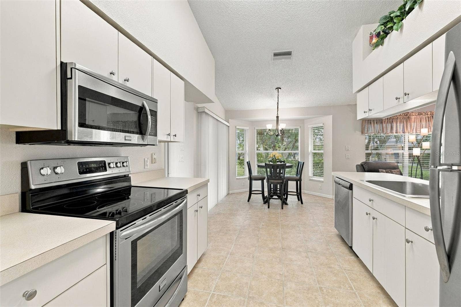 1149 WOLFORD DRIVE, New Port Richey, FL 34655 Features stainless-steel appliances and ample cabinet/storage space