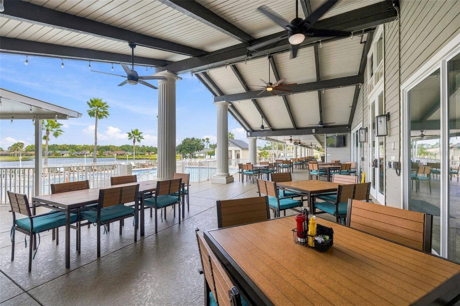 1149 WOLFORD DRIVE, New Port Richey, FL 34655 Lots of outdoor/patio seating at the clubhouse overlooking the pool
