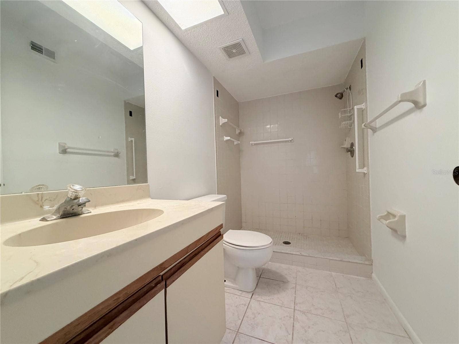 8151 HEATHERWOOD DRIVE, #111, Seminole, FL 33777 Master bathroom w/ shower