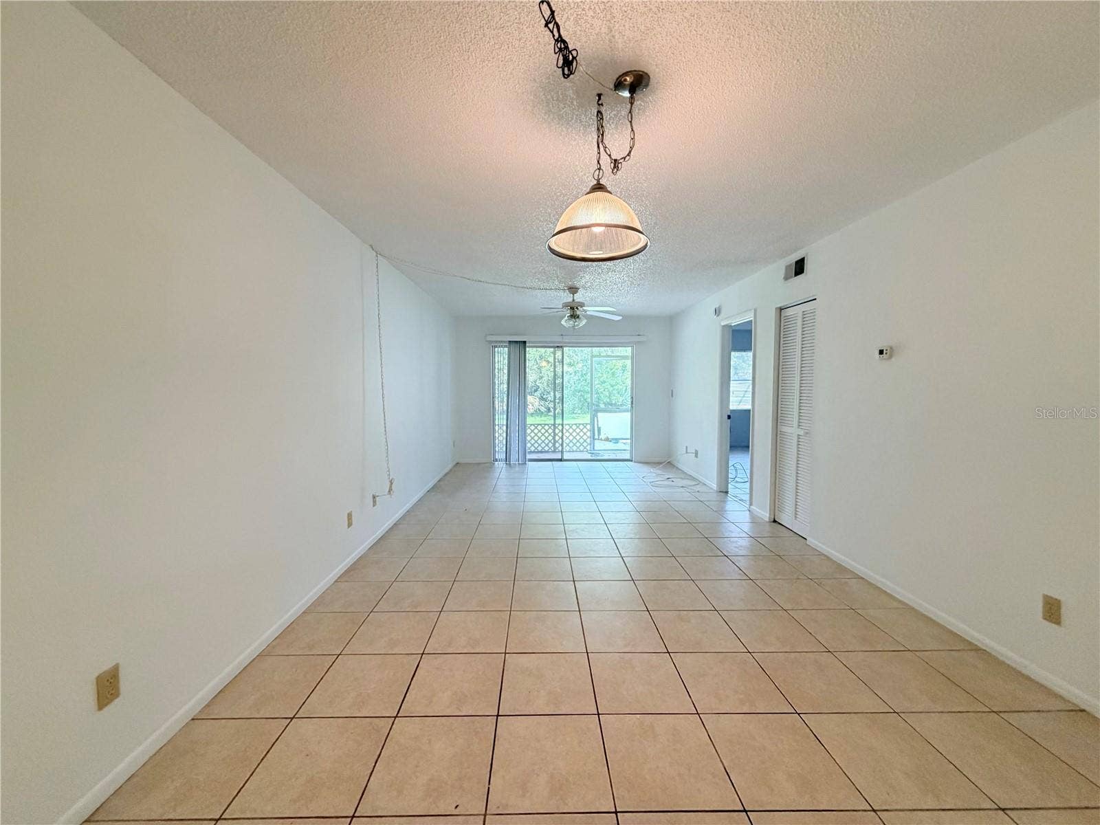 8151 HEATHERWOOD DRIVE, #111, Seminole, FL 33777 Dining and living room combo