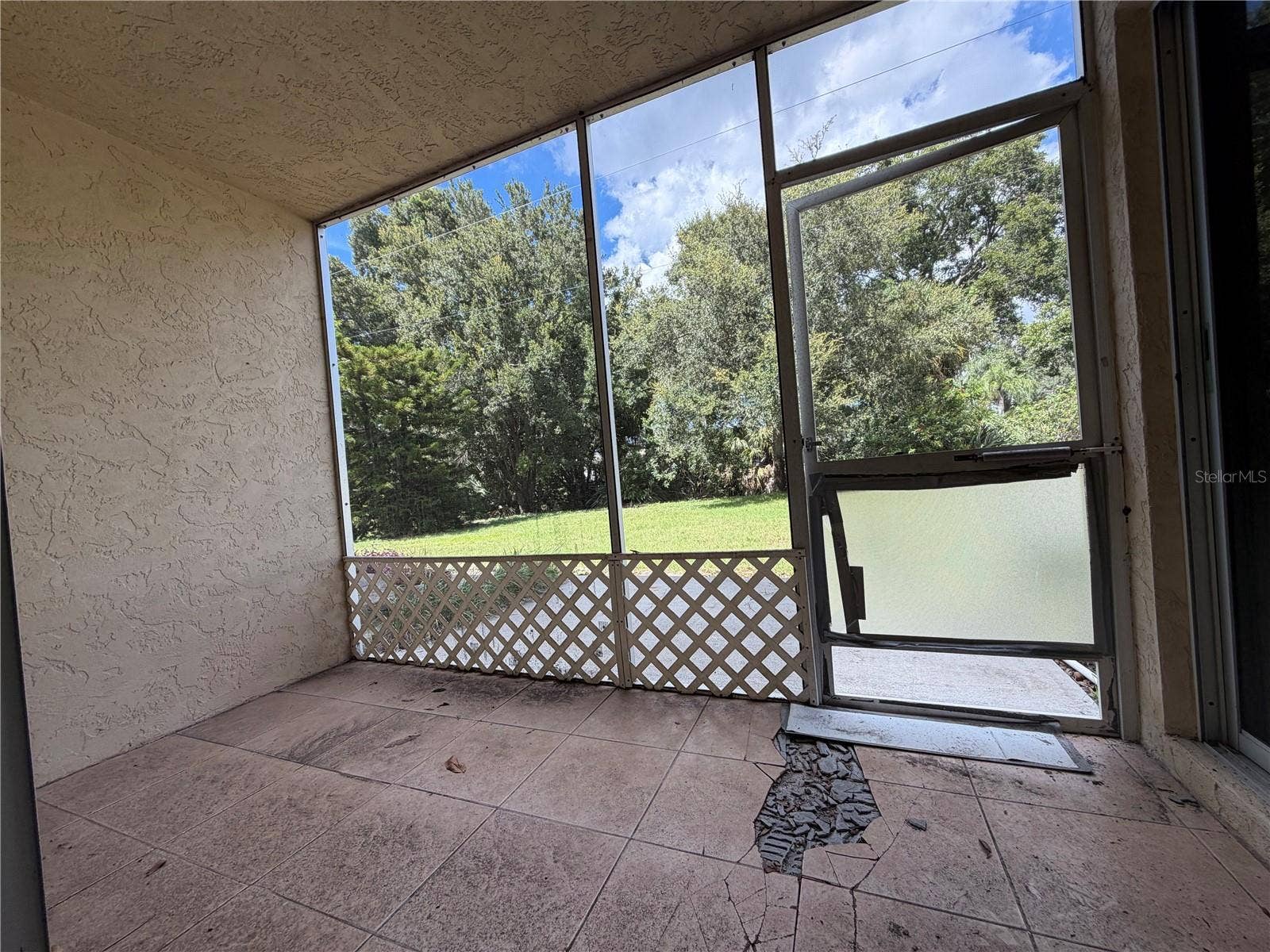8151 HEATHERWOOD DRIVE, #111, Seminole, FL 33777 rear back patio/screened in