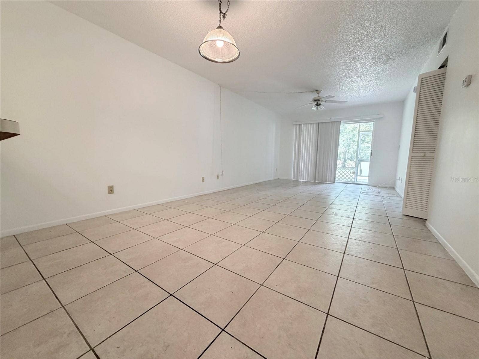 8151 HEATHERWOOD DRIVE, #111, Seminole, FL 33777 Dining and living room combo