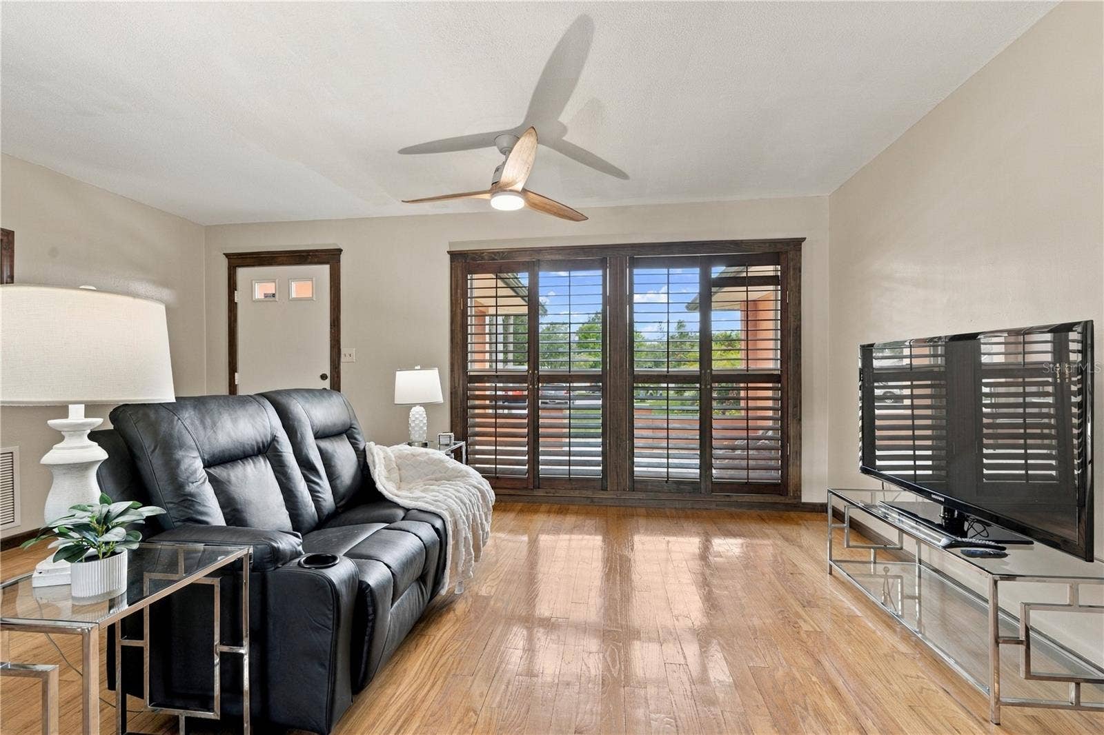 112 PEACOCK CIRCLE, Safety Harbor, FL 34695 11. Front Living Room is (12.7 x 15') .. with Wood Shutters for a Touch of Elegance!