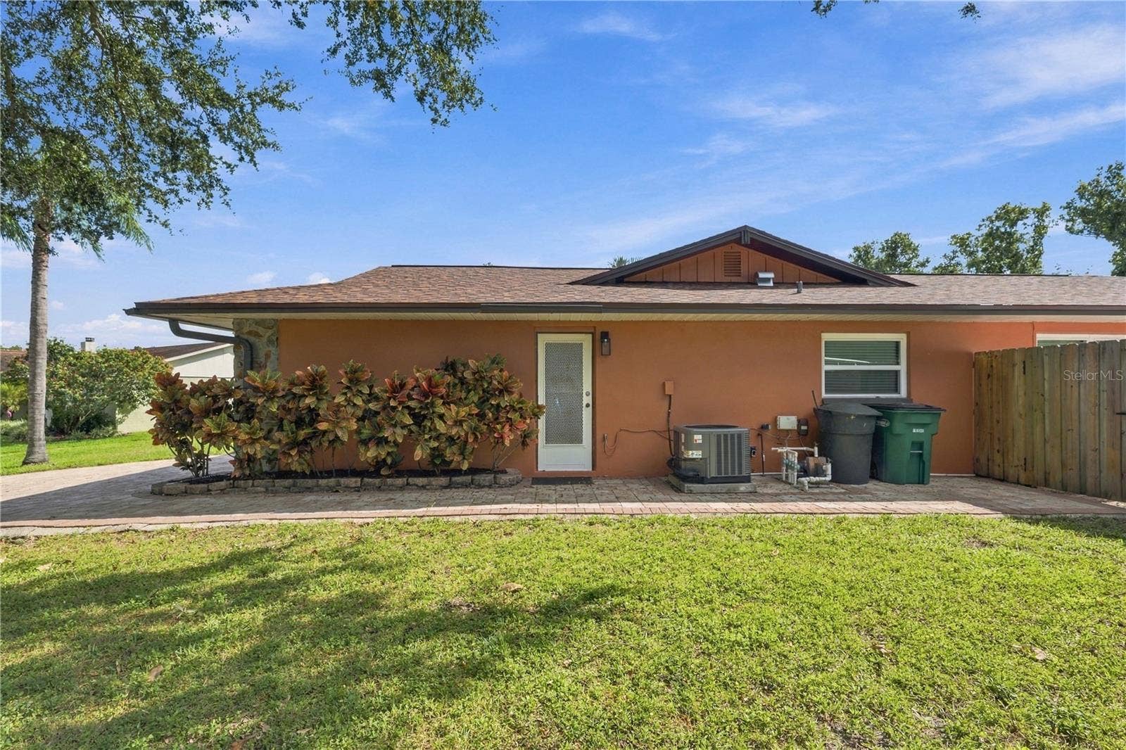 112 PEACOCK CIRCLE, Safety Harbor, FL 34695 77a. Northern Side of Home.. Designated Garbage Can Storage so You Can Use More of Your Garage!