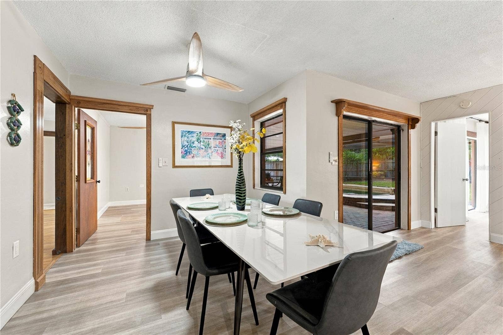 112 PEACOCK CIRCLE, Safety Harbor, FL 34695 48. Dining Area (12.8 x 9.1) Leads into Bonus Room/Den .. Receives Loads of Light.. & Part of the Great Room... w Kitchen/Family Rooms!