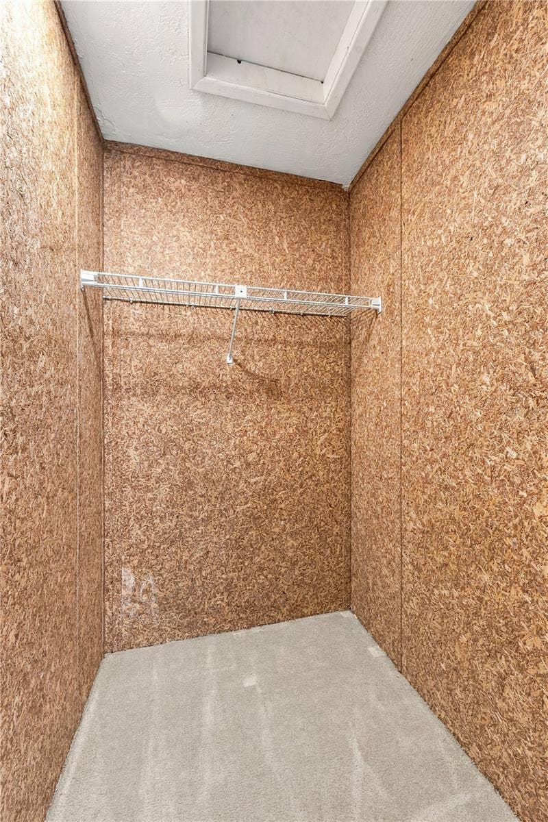 112 PEACOCK CIRCLE, Safety Harbor, FL 34695 26a. Walk In Closet (5.3 x 4.3') is a Super Spacious Cedarboard Style w Attic Access.