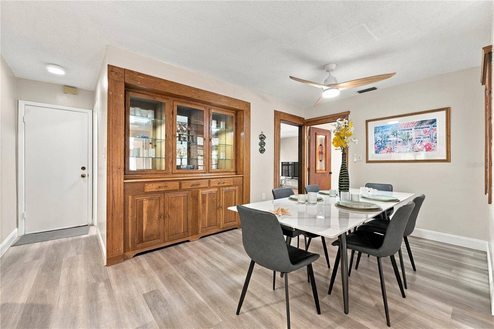 112 PEACOCK CIRCLE, Safety Harbor, FL 34695 46. Dining Area (12.8 x 9.1) Within Great Room is Plenty Spacious.. Table Extended w Both Leaves to Show the Capacity for Dining..