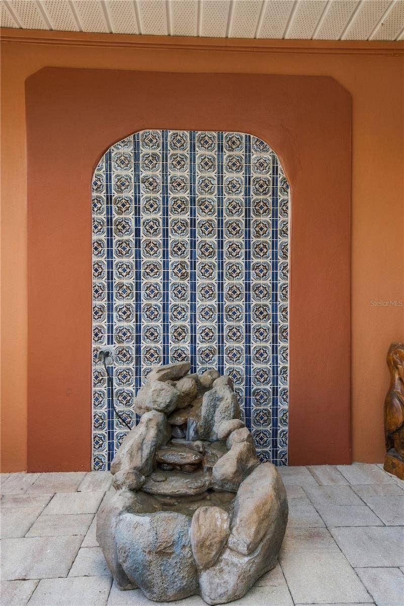 112 PEACOCK CIRCLE, Safety Harbor, FL 34695 41b. Arch Tile Detail Adds an Exotic Elegance to the Courtyard Entry... The Trickling Fountain is the Cherry on Top!