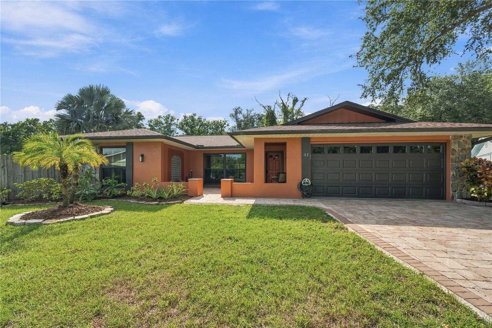 112 PEACOCK CIRCLE, Safety Harbor, FL 34695 41a. FULL EXTERIOR Freshly Painted Warm Welcoming Hues... This Home is Set Apart from the Rest.. In a Good Way!