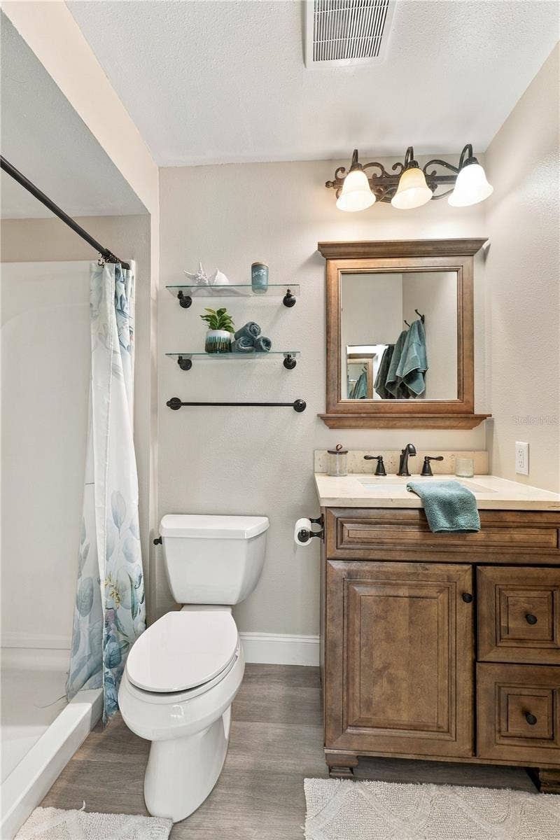 112 PEACOCK CIRCLE, Safety Harbor, FL 34695 23. Owner's Retreat Full Bath (4.9 x 8.1'), FULLY UPDATED.. w Walk in Shower!