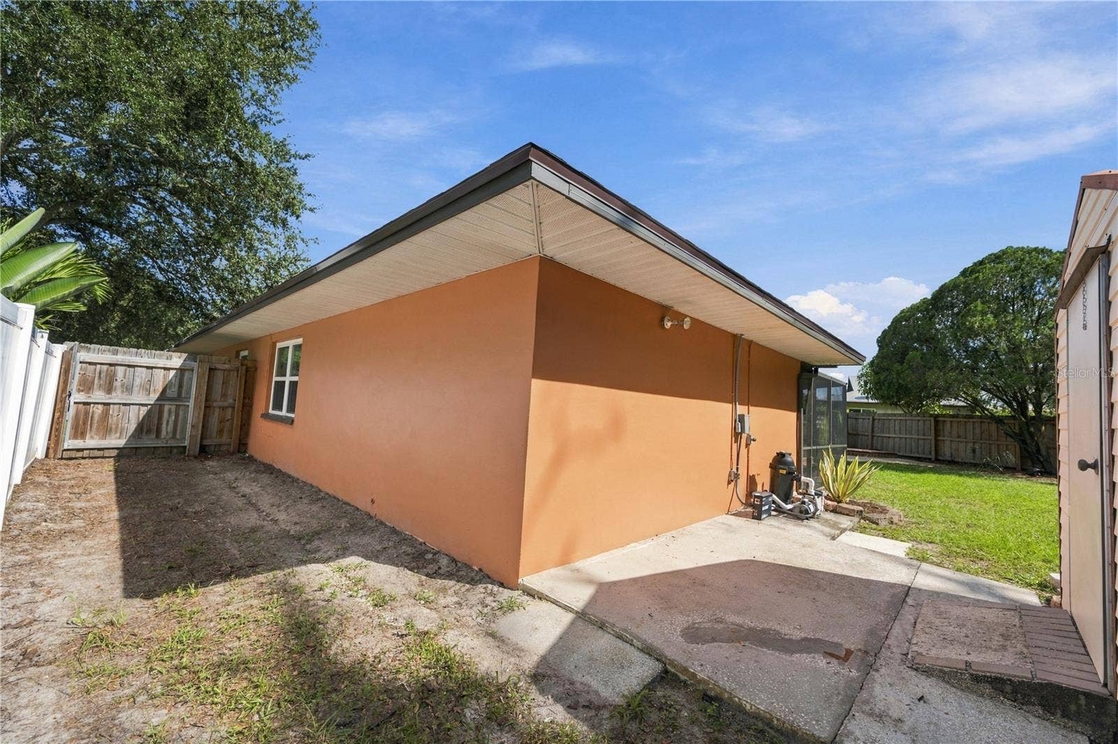 112 PEACOCK CIRCLE, Safety Harbor, FL 34695 77. North West Corner/Side of Home.. Showing Concrete Slab Out of Shed..