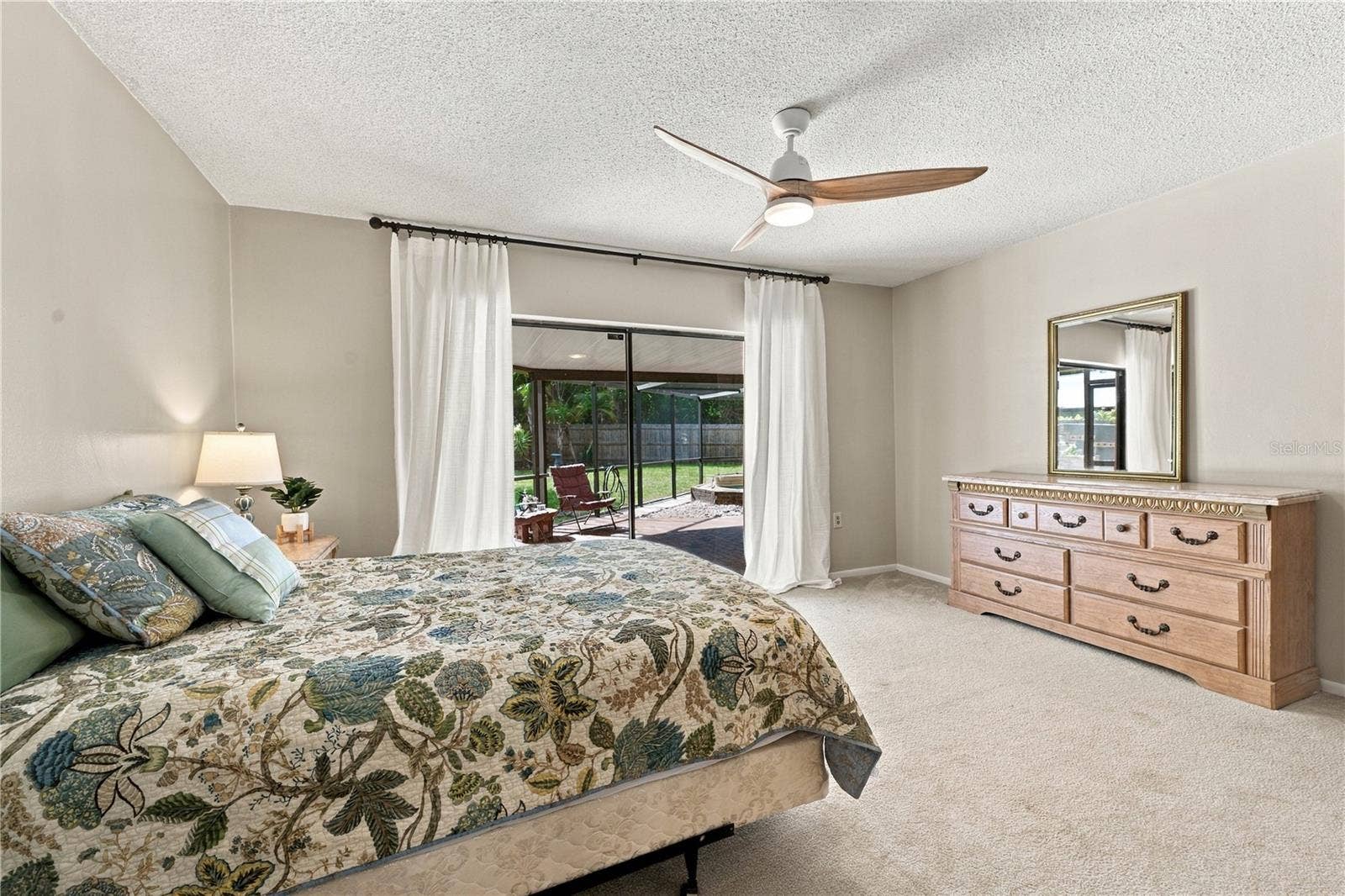 112 PEACOCK CIRCLE, Safety Harbor, FL 34695 25. Bedroom #2 (11.7 x 15) Features Oversized Sliders to Lanai!
