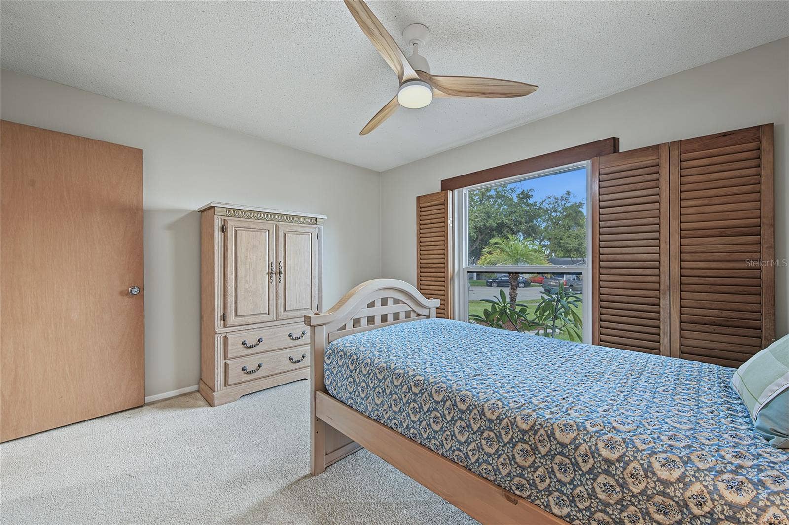 112 PEACOCK CIRCLE, Safety Harbor, FL 34695 28. Bedrm #3 (11 x 12.9') Features Wood Shutters that Open Out to the Wall if Desired, or Adjust the Slats..