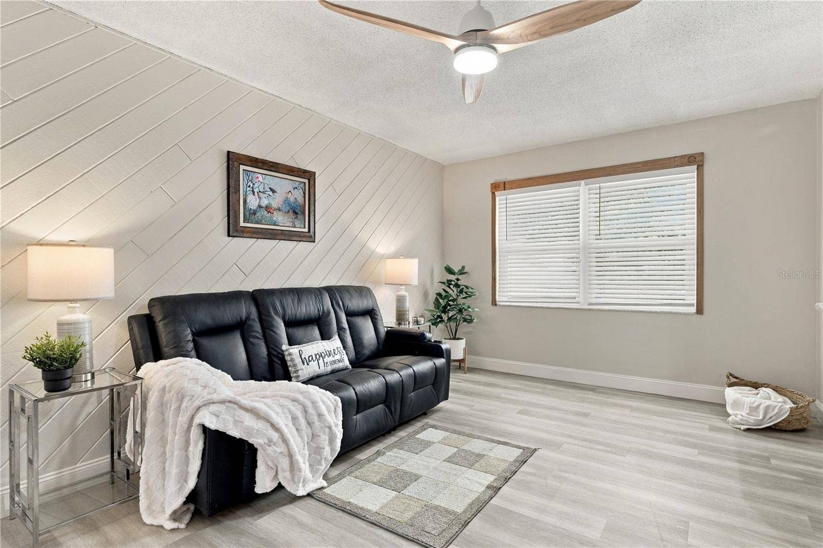 112 PEACOCK CIRCLE, Safety Harbor, FL 34695 55. Family Room (18.9 x 10.10') with Awesome Wood Accent Wall, Slats Running Diagonally - Creating Visual Interest!!