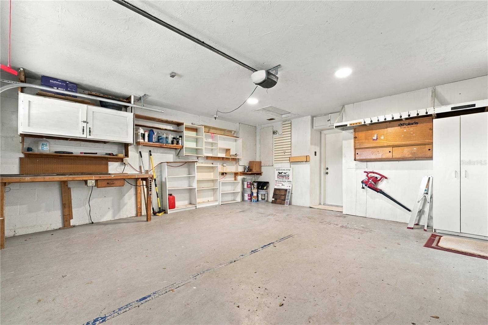 112 PEACOCK CIRCLE, Safety Harbor, FL 34695 68a. Garage with FRESHLY Painted Ceiling! Plenty of Storage.. 3 of the Bookshelves Shown in Picture Have Been Removed.. Existing Storage is Sturdy & Ready for Your Storage Needs!