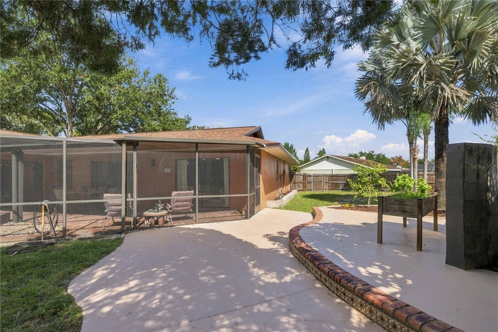 112 PEACOCK CIRCLE, Safety Harbor, FL 34695 70. Shade Trees Over the 2-Tier Patio Keep You Cool..