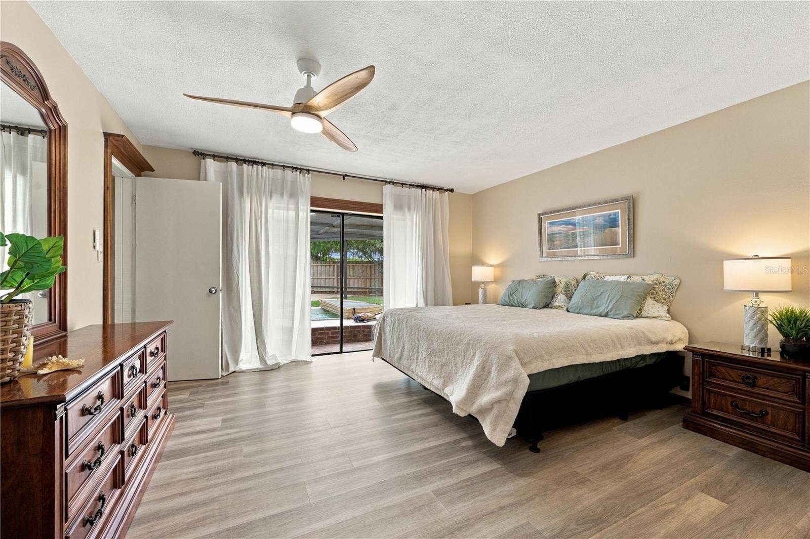 112 PEACOCK CIRCLE, Safety Harbor, FL 34695 22. Owner's Retreat Features Oversized Sliders to the Lanai.. w a View of the Hot Tub!