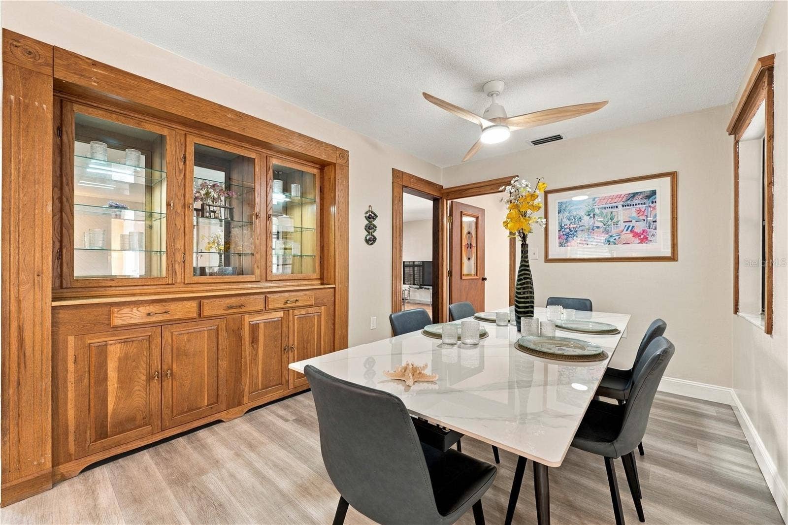 112 PEACOCK CIRCLE, Safety Harbor, FL 34695 18. Dining Area (12.8 x 9') Has a Gorgeous Solid Wood Custom Built In Hutch for Your Dinnerware..