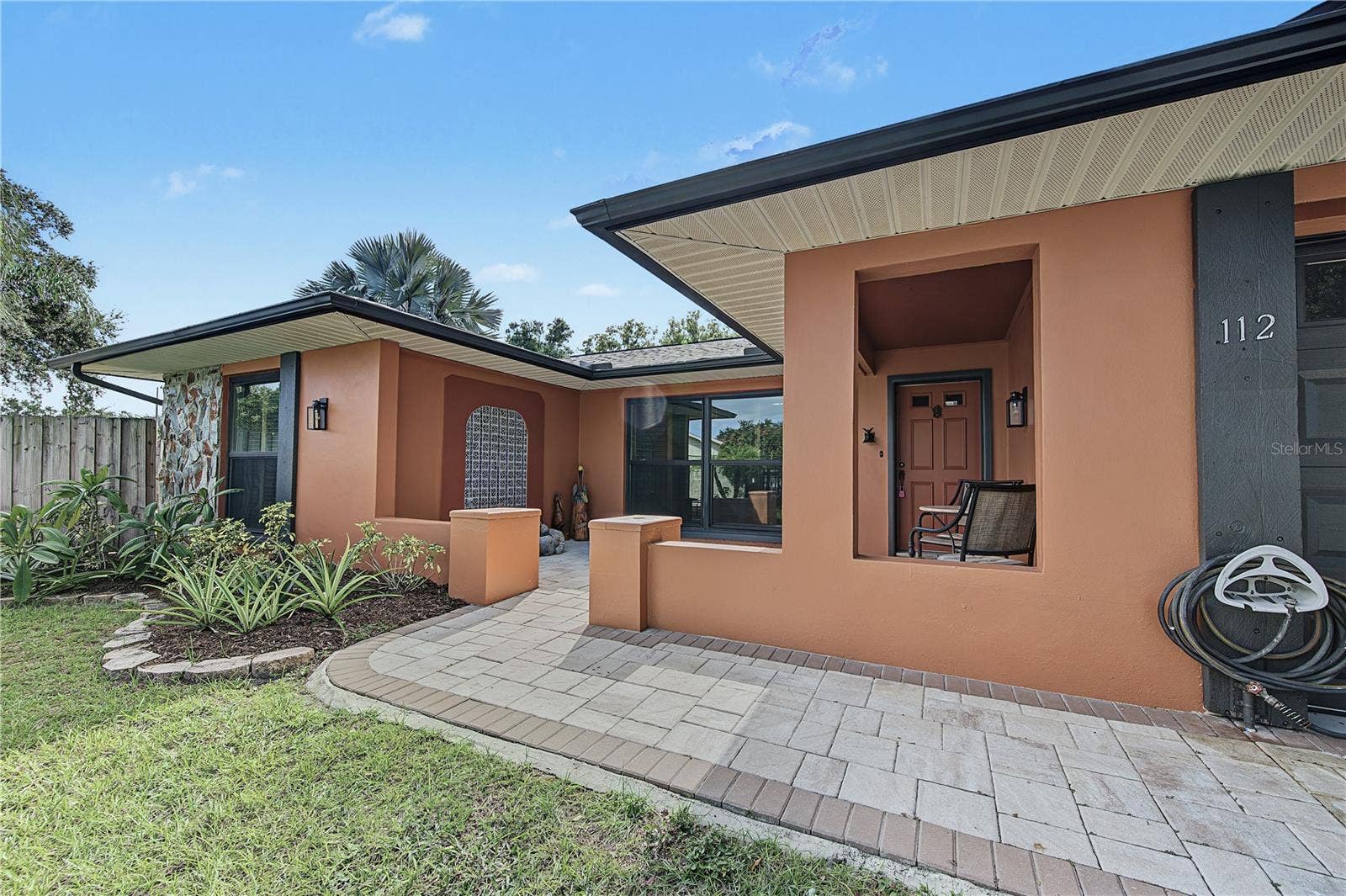 112 PEACOCK CIRCLE, Safety Harbor, FL 34695 6. Pavers Laid Into Courtyard Entry to Create a QQuaint Front Patio for Outdoor Living!