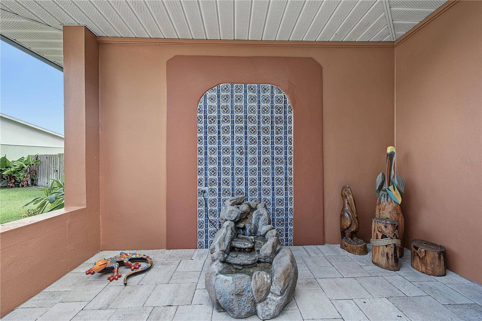 112 PEACOCK CIRCLE, Safety Harbor, FL 34695 7. Mosaic Tile Inlet is Emphasized w/ Terra Cotta Paint to Accentuate the Unique Design.. the Fountain Trickling Water is a PLUS too..