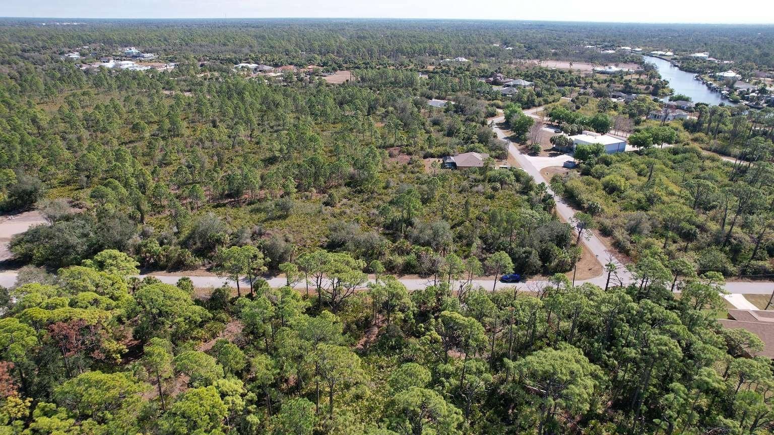 1262 SANFORD STREET, Port Charlotte, FL 33953 Aerial view of surrounding area; nearby water is not part of the property.