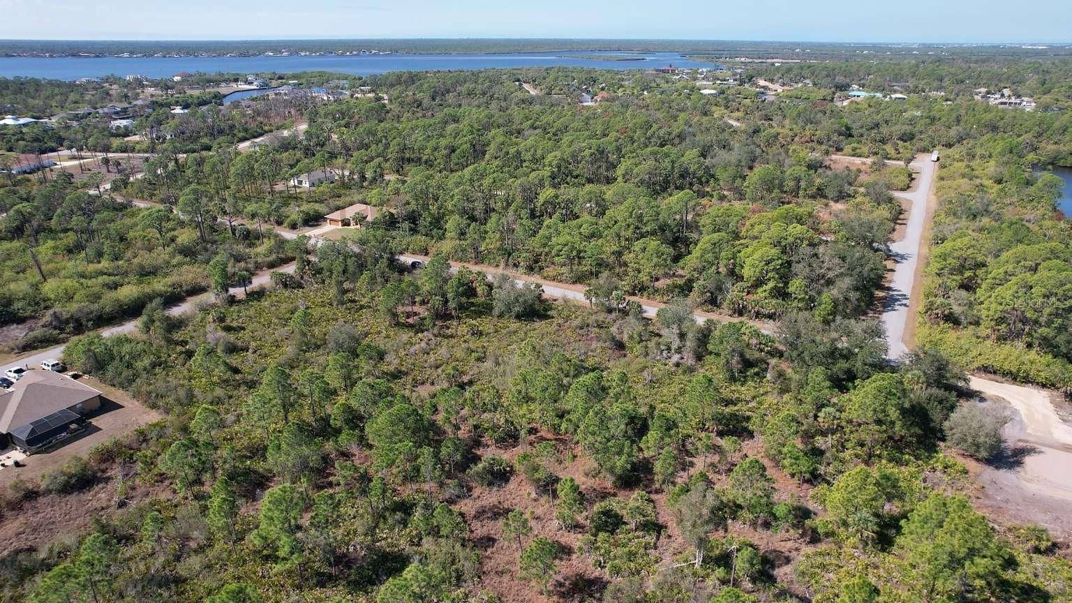 1262 SANFORD STREET, Port Charlotte, FL 33953 Aerial view of surrounding area; nearby water is not part of the property.