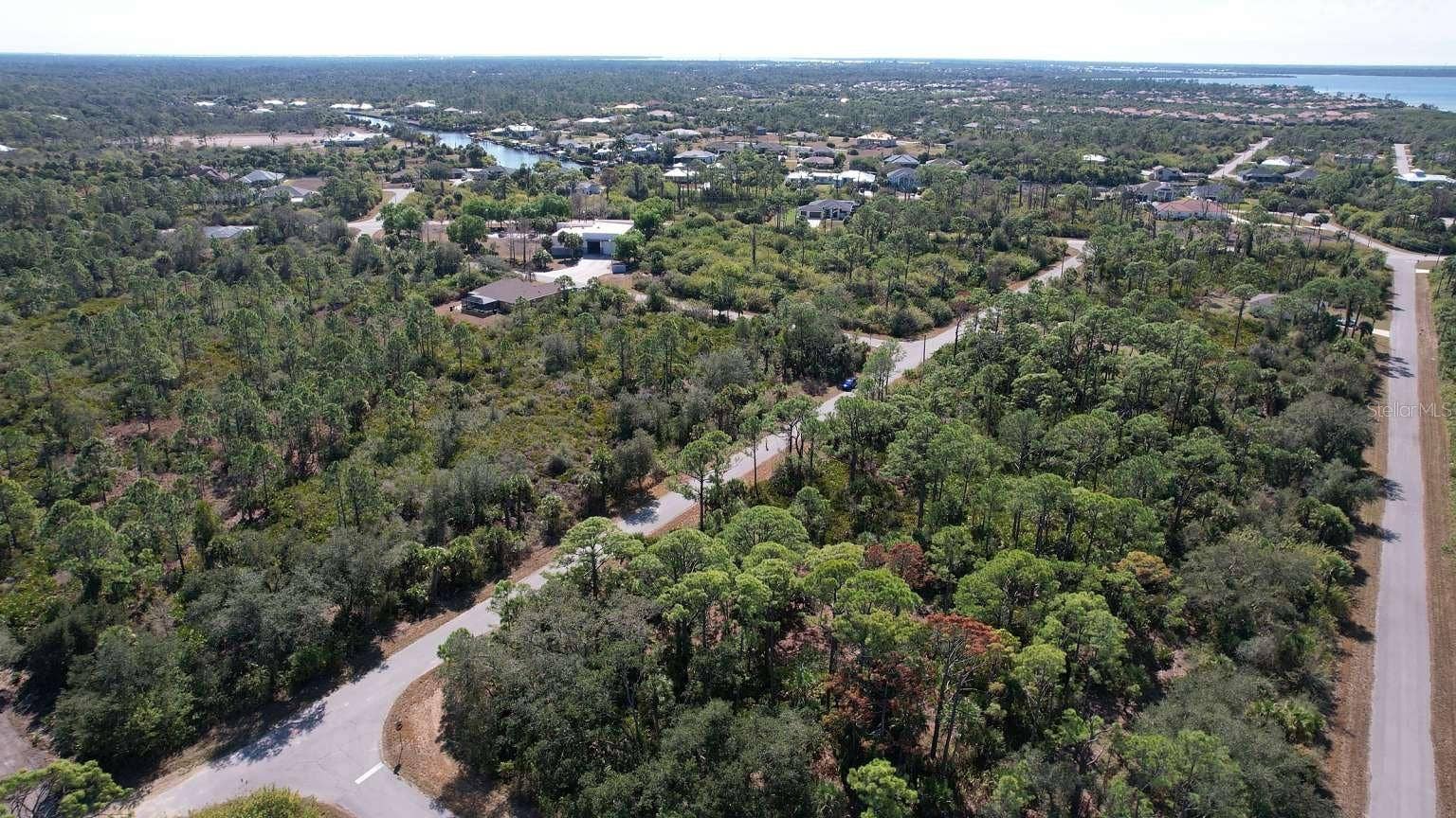 1262 SANFORD STREET, Port Charlotte, FL 33953 Aerial view of surrounding area; nearby water is not part of the property.