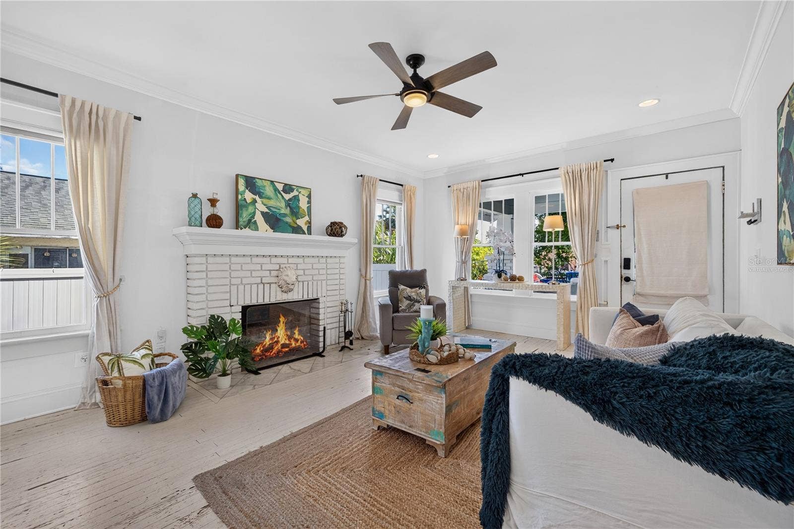 2106 8TH AVENUE W, Bradenton, FL 34205 Living room (Fire in fireplace is virtually staged)