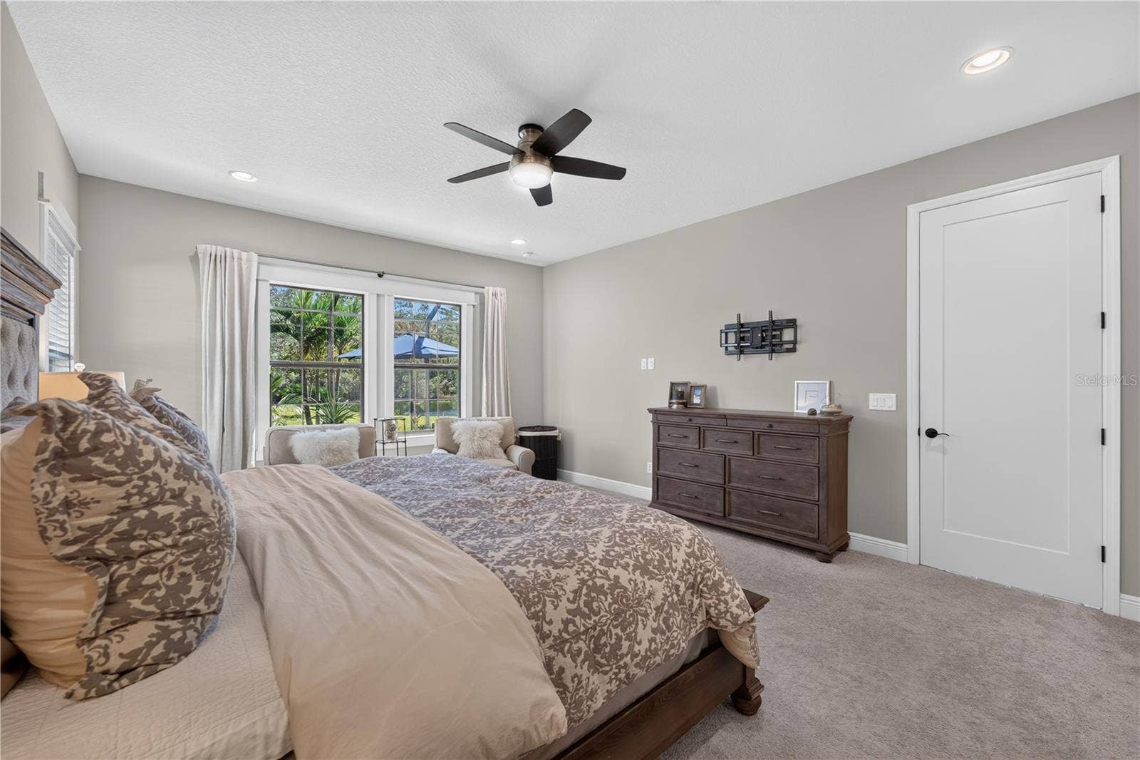 Primary Suite with views of the pool and conservation.