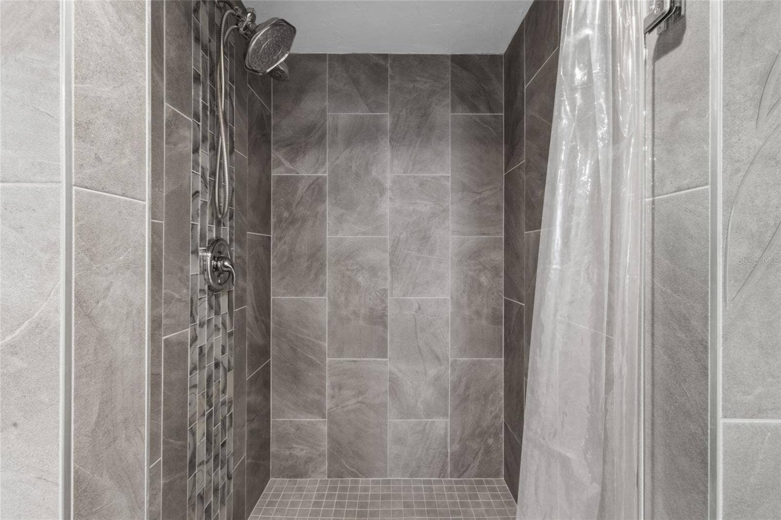 17920 GULF BOULEVARD, #302, Redington Shores, FL 33708 remodeled shower in Primary