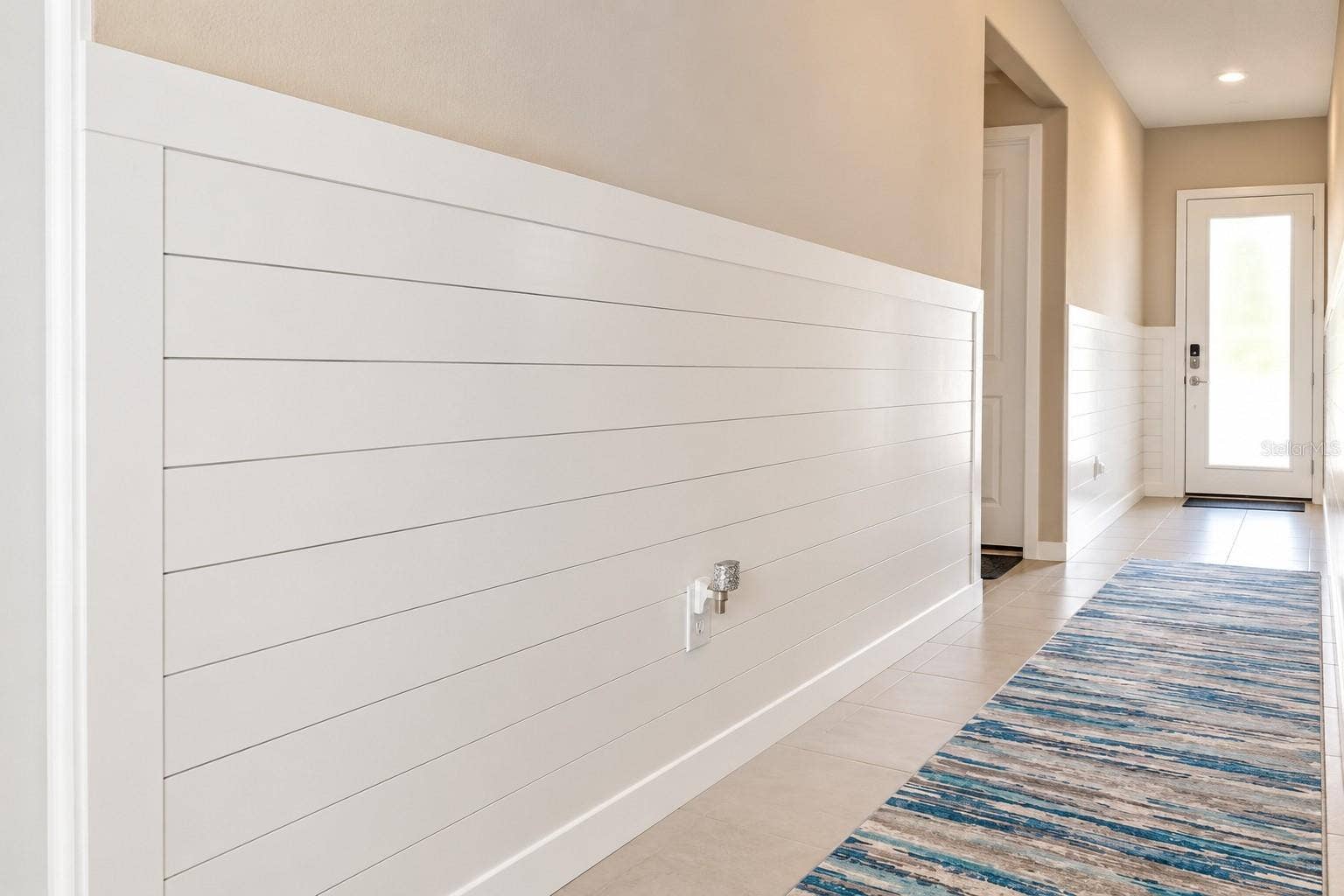 Modern Shiplap Hallway to Bright Entry