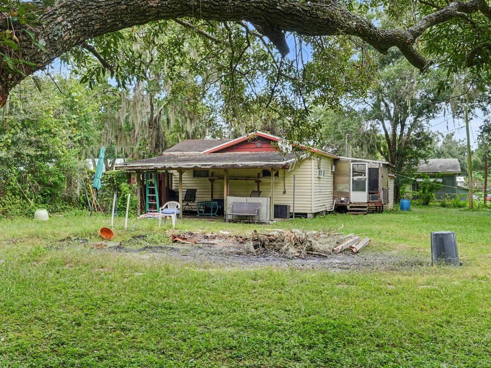3015 STRAWBERRY LANE, Lakeland, FL 33801 Tree-Shaded Property with Fire Pit & Covered Patio Entertaining Space
