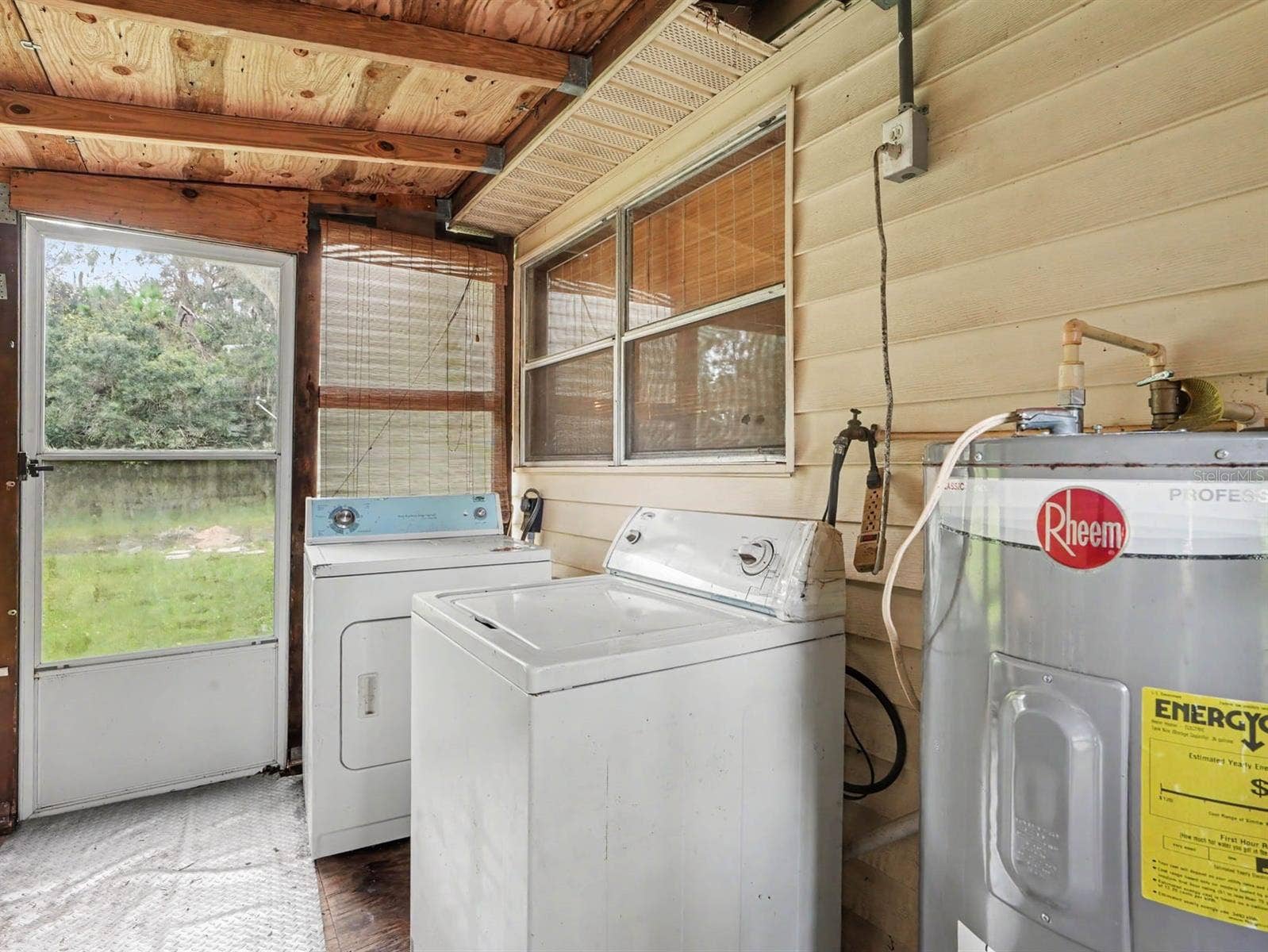 3015 STRAWBERRY LANE, Lakeland, FL 33801 Laundry Room with Washer, Dryer & Water Heater Access to Yard