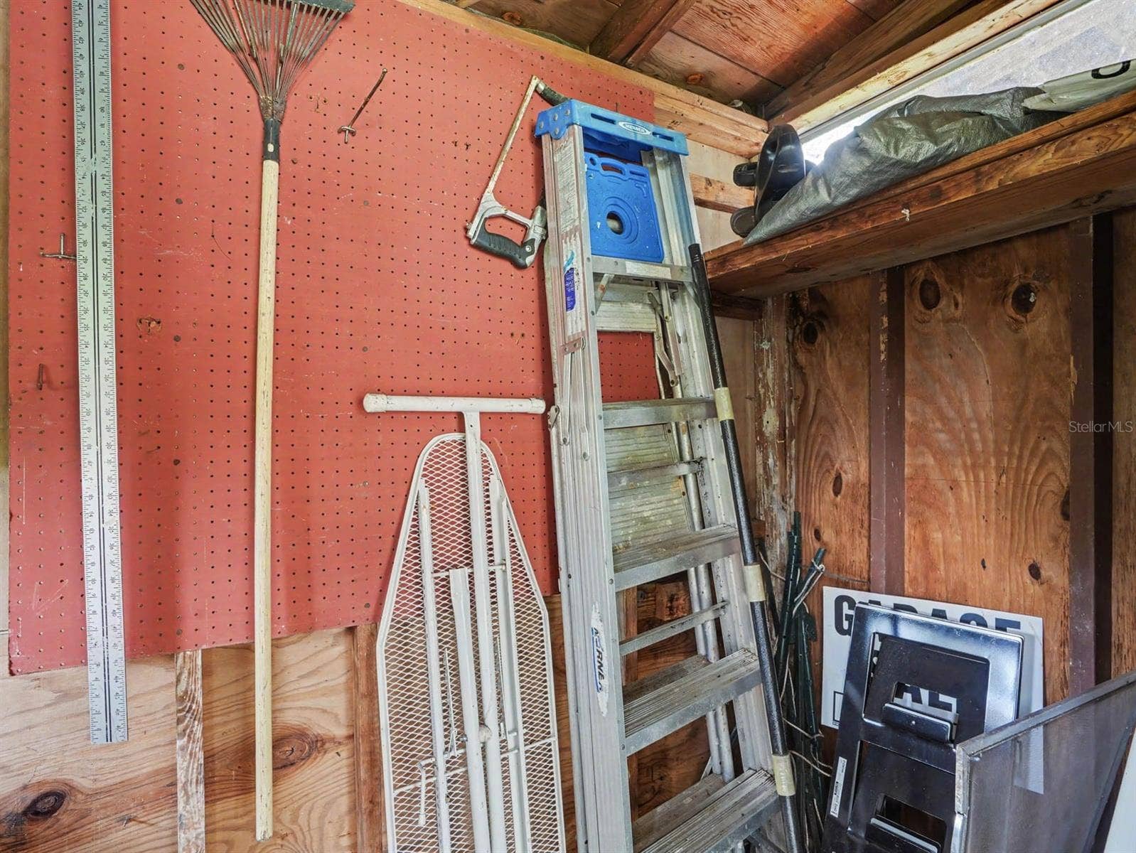 3015 STRAWBERRY LANE, Lakeland, FL 33801 Workshop Storage with Pegboard, Ladder & Shelving Organization