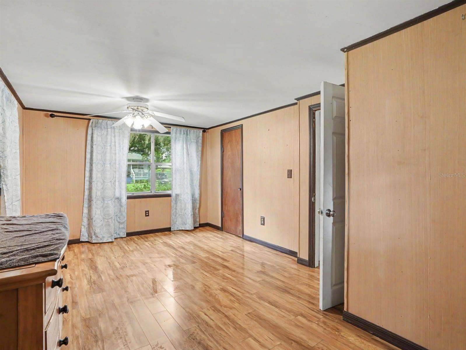 3015 STRAWBERRY LANE, Lakeland, FL 33801 Comfortable Bedroom with Wood Floors, Window Seat & Direct Patio Access