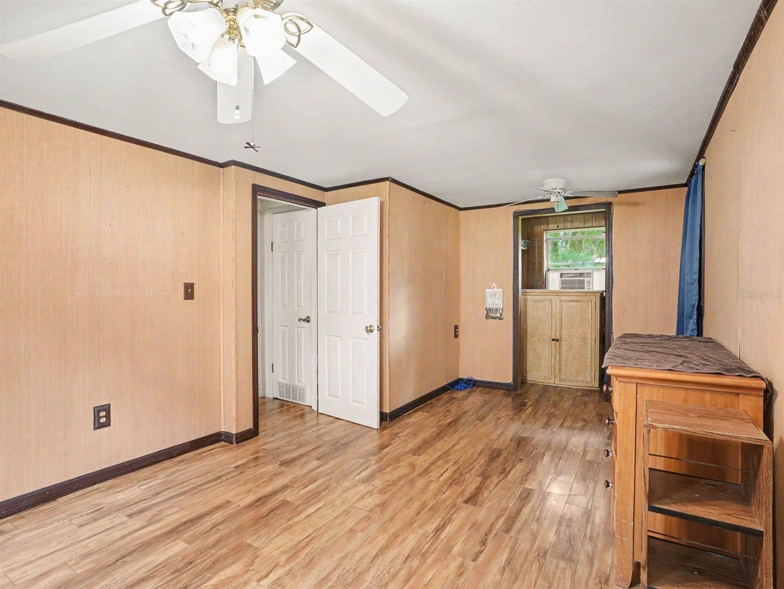 3015 STRAWBERRY LANE, Lakeland, FL 33801 Generously Sized Bedroom with Wood Flooring, Multiple Windows & Closet Space