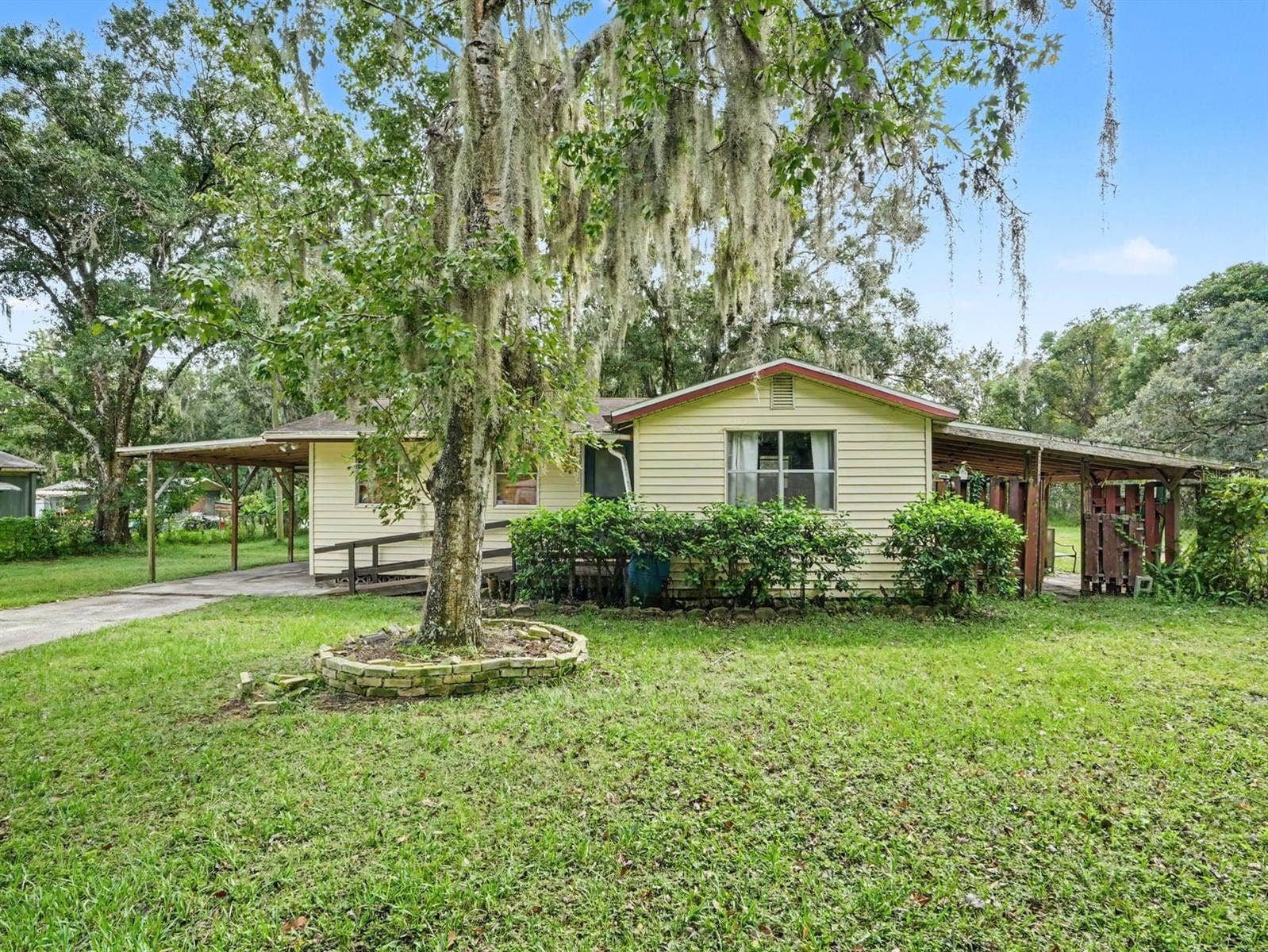 3015 STRAWBERRY LANE, Lakeland, FL 33801 Mature Oak Trees Frame This Cozy Single-Wide Residence